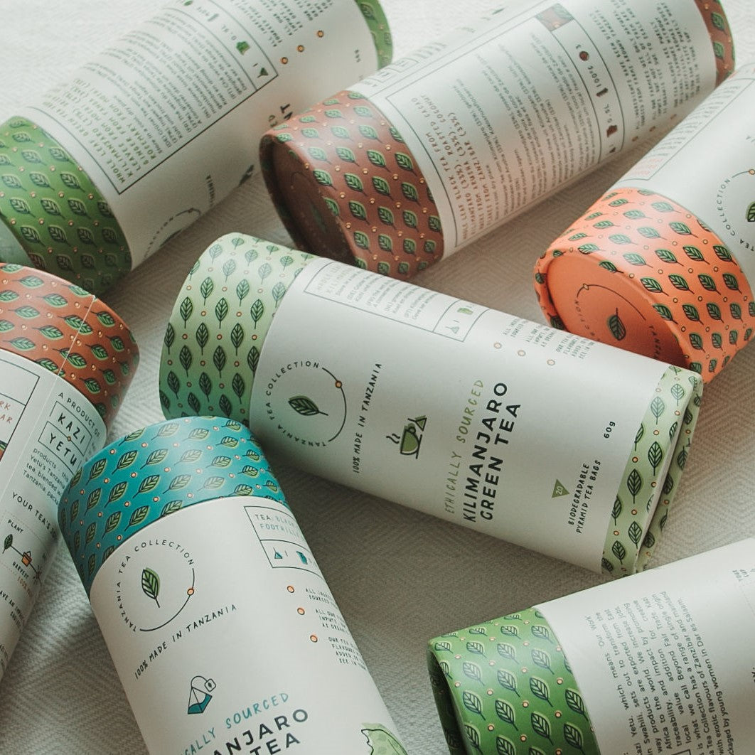 Display of various Africa Tea Collection tubes laying on a blanket