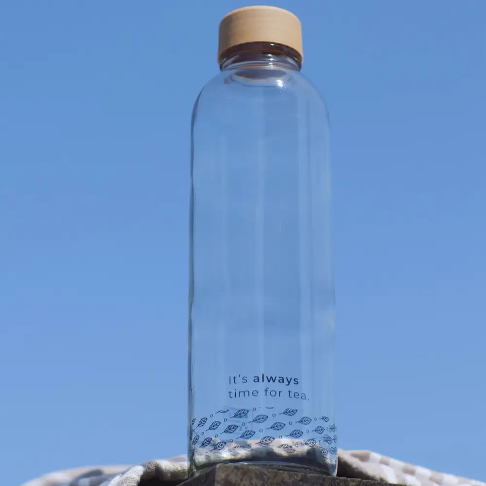 Sustainable glass bottle with Kazi Yetu branding, front