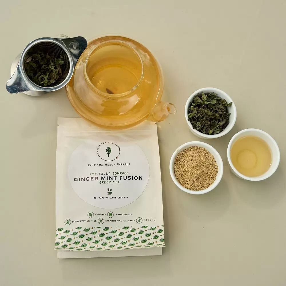 Product picture of handcrafted Ginger Mint Fusion tea blend 100 gram loose leaf paper bag and tea pot