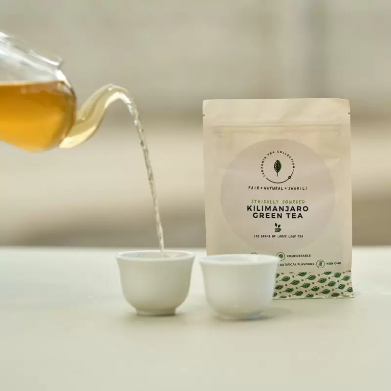 Product picture of organically farmed Kilimanjaro Green Tea loose leaf poured into cup